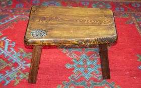 Stool of Shaped Rectangular Form on Splayed Square Legs, with plaque Harry Tonkin, Corran, Cornwall.