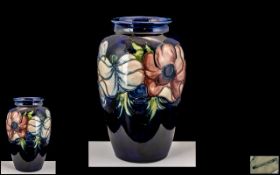 Moorcroft Tube Lined Ovoid Shaped Vase ' Anemone ' Design on Blue Ground.