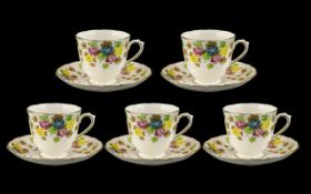 Tuscan China Set of five cups and saucers 'Plant' pattern,