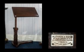 An Edwardian Mahogany Gentleman's Adjustable Reading Stand on a ratchet mechanism by Levinson's and