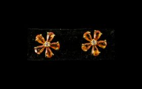 Sunset Orange Sapphire Floral Stud Earrings, each earring comprising five pear cut,