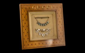 Vintage Gucci Jewellery Display Frame with gold Gucci on decorative wooden frame,