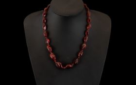 A Modern Cherry Amber Coloured Necklace. Amber necklace in natural form and in graduating style,