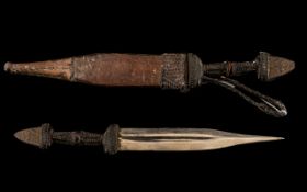 Antique North African Arab Dagger of Fine Quality. The Leather Scabbard Finely tooled with a Geo-