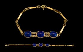 Ladies Attractive 18ct Yellow Gold Bracelet Set with 3 Cabochon Cut Lapis Lazuli Stones.