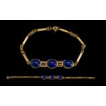 Ladies Attractive 18ct Yellow Gold Bracelet Set with 3 Cabochon Cut Lapis Lazuli Stones.