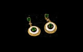 Russian Diopside Drop Earrings, a pair of circular pendant drops, each with a round cut, deep green,