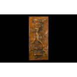 A Coppered Rectangular Plaque depicting a semi clad maiden with cherubs,
