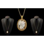 Ladies 9ct Gold Mounted Oval Shaped Shell Cameo Attached to a Long 9ct Gold Chain,