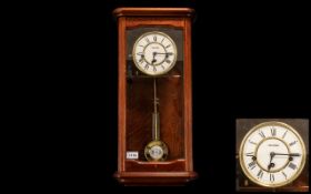 Mahogany Cased Wall Clock with pendulum.