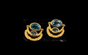 Pair of Swiss Blue Topaz Drop Earrings, the two larger, oval cut topaz,