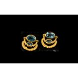 Pair of Swiss Blue Topaz Drop Earrings, the two larger, oval cut topaz,