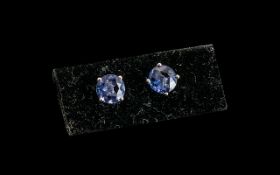 Colour Change Fluorite Stud Earrings, the round cut 2cts of blue fluorite turn a deep pinkish purple