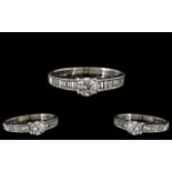 18ct White Gold - Nice Quality Diamond Set Ring. The Central Round Brilliant Cut Diamond of