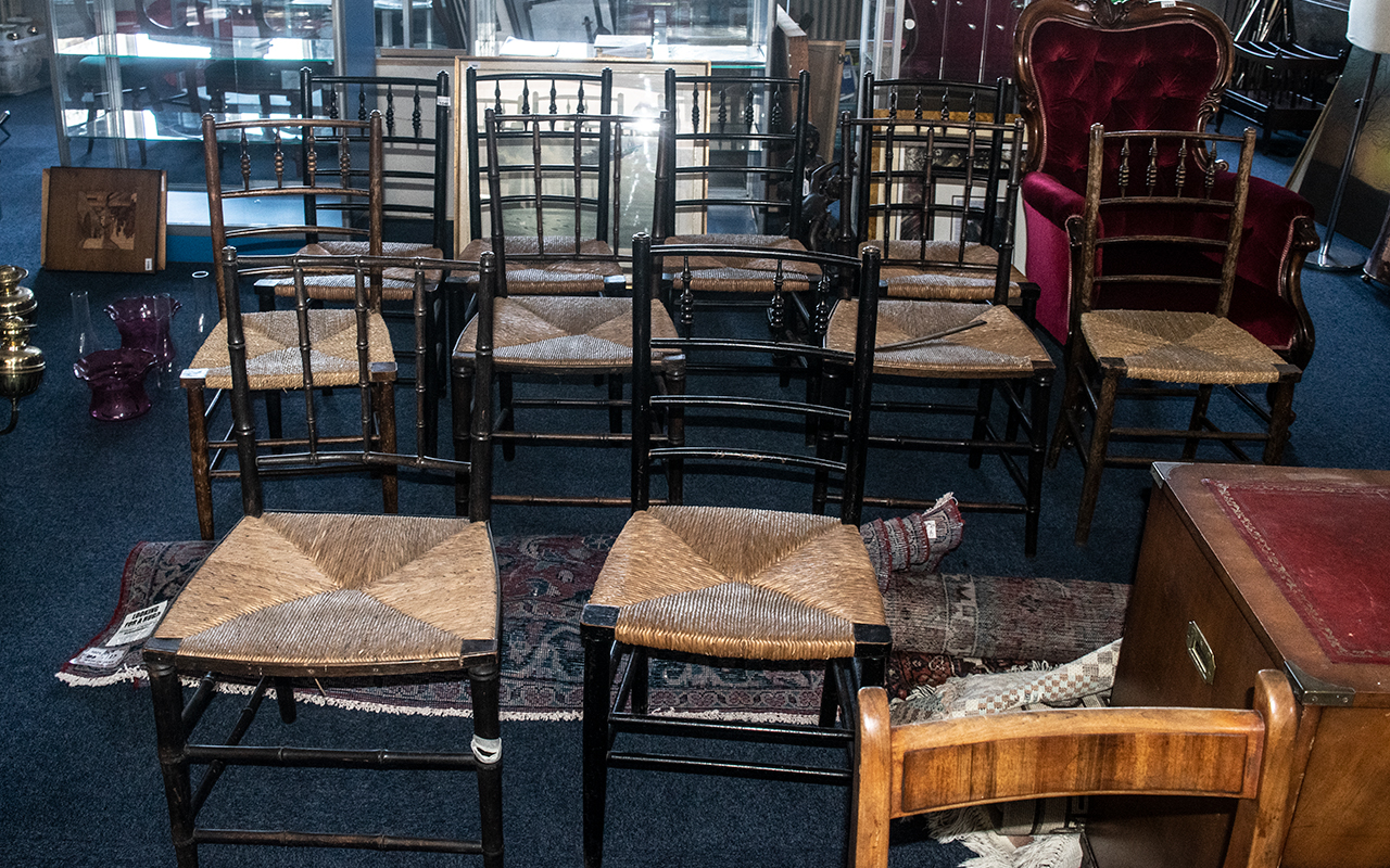 A Harlequin Set of 10 William Morris Suffolk Style Rush Seated Country Chairs, in stained beech.