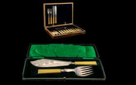 A Cased Set of 8 Fish Knives & Forks together with a set of fish servers.