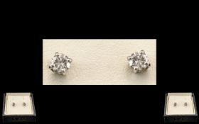 18ct White Gold - Attractive Diamond Set Pair of Stud Earrings. The Round Brilliant Cut Diamonds