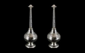 A Pair of Middle Eastern Engraved White Metal Rose Water Sprinklers, Engraved with Floral Images.