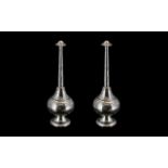 A Pair of Middle Eastern Engraved White Metal Rose Water Sprinklers, Engraved with Floral Images.