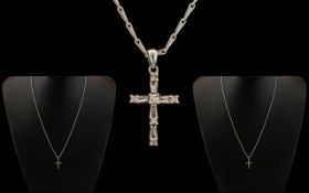 A 9ct White Gold Diamond Set Small Cross Attached to a 9ct White Gold Fancy Chain. Both Fully