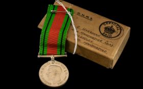 1939-1945 Defence Medal on ribbon, in original brown cardboard OHMS box addressed to Mr C Hardman,