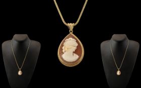 A 9ct Gold Mounted Shell Cameo Pendant - Attached to a 9ct Gold Quality Long Chain. Both Marked