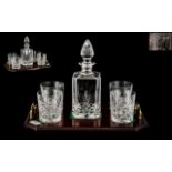 A Whisky Decanter and Four Tumblers housed on a twin handled tray with mahogany finish. Tray