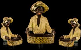 Goldscheider Style 1920s Shop Display of a young black plantation worker holding a basket; 15.5