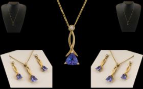 Ladies 9ct Gold - Attractive Blue Topaz Set Pendant and Matching Pair of Earrings. The Pendant