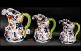 Three Rington's Tea Merchants Jugs, hand painted with blue and gilt floral decoration with green