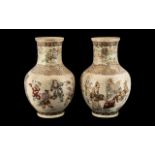 A Pair of Oriental Japanese Satsuma Vases of bulbous form, in cream ground depicting figures with