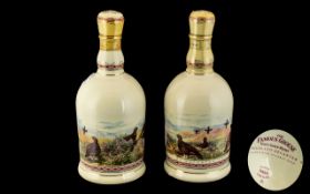 Two Famous Grouse Whisky Porcelain Collectible Bottles. Two bottles of Famous Grouse housed within a