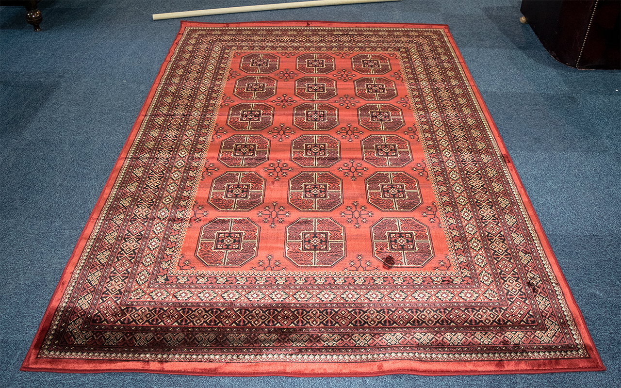 A Genuine Cashmere Red Ground Carpet/Rug. Bukhara design.As new condition. Measures 2.40 by 1.60