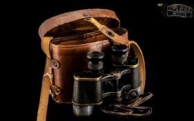 Pair of Field Binoculars marked Carl Zeiss Wien, with a brown leather case with military markings.