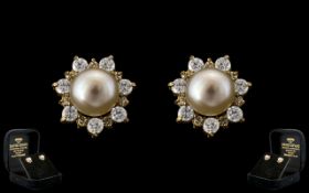 Ladies Fine Pair of 9ct Gold Pearl and Diamond Set Earrings ( Pierced ) In a Flower head Design.