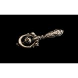 Early 20th Century Silver Rattle, the handle decorated with cherubs; fully hallmarked