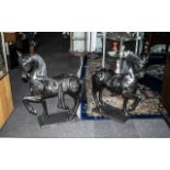 Pair of Large Cast Bronze Stylised Horses wearing decorative Oriental saddles with adornments; the