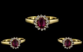 18ct Gold - Attractive Diamond and Ruby Set Dress Ring - Flower head Setting. Marked 18ct to