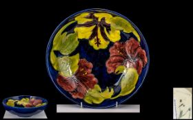 Moorcroft Tube lined Footed Bowl of Large Proportions ' Hibiscus ' Design on Blue Ground. c.1940'