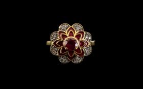 Ruby Centred Flower Ring, a stylised flower of eight petals with a 1.5ct ruby to the centre