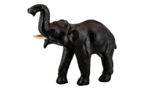 1940s/50s Leather Elephant in the Dimitri Omersa Style, the elephant with raised trunk, a pose