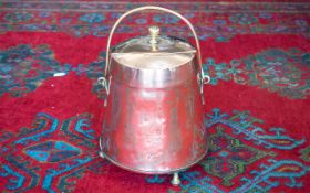 19th Century Dutch Copper Lidded Milk Bucket with a brass swing handle, terminating on brass cast