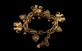 Gold Plated Charm Bracelet, loaded with charms; please see attached image