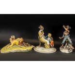 Three Porcelain Figures depicting a golfer, a mother and child and a fisherman. A/F, confirm with