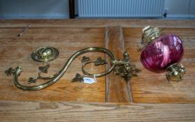 An Antique Brass Gasolier Wall Fitting converted into a ruby font with funnel. Measuring 19 inches