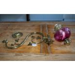 An Antique Brass Gasolier Wall Fitting converted into a ruby font with funnel. Measuring 19 inches