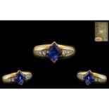 18ct Yellow Gold - Attractive Sapphire and Diamond Set Dress Ring. The Central Cornflower Blue