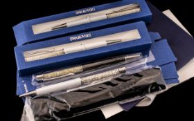 Collection of 5 Swarovski Pens, Some with Packaging. Never Used. Various Colours. Please See Photo.