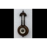 Small Carved Walnut Wall Barometer and thermometer, with a carved surround and column decoration.