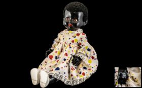 Rare Vintage Large Black Doll, with Moveable Joints and Closed Eyes. Approx 22 Inches In length.